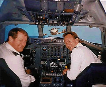 "Hey John, Candy and Melanie are our air stewardesses today. Time to set to auto pilot and invite them into our cock-pit."   "Its a good job their husbands in air traffic control dont know what they get up to."